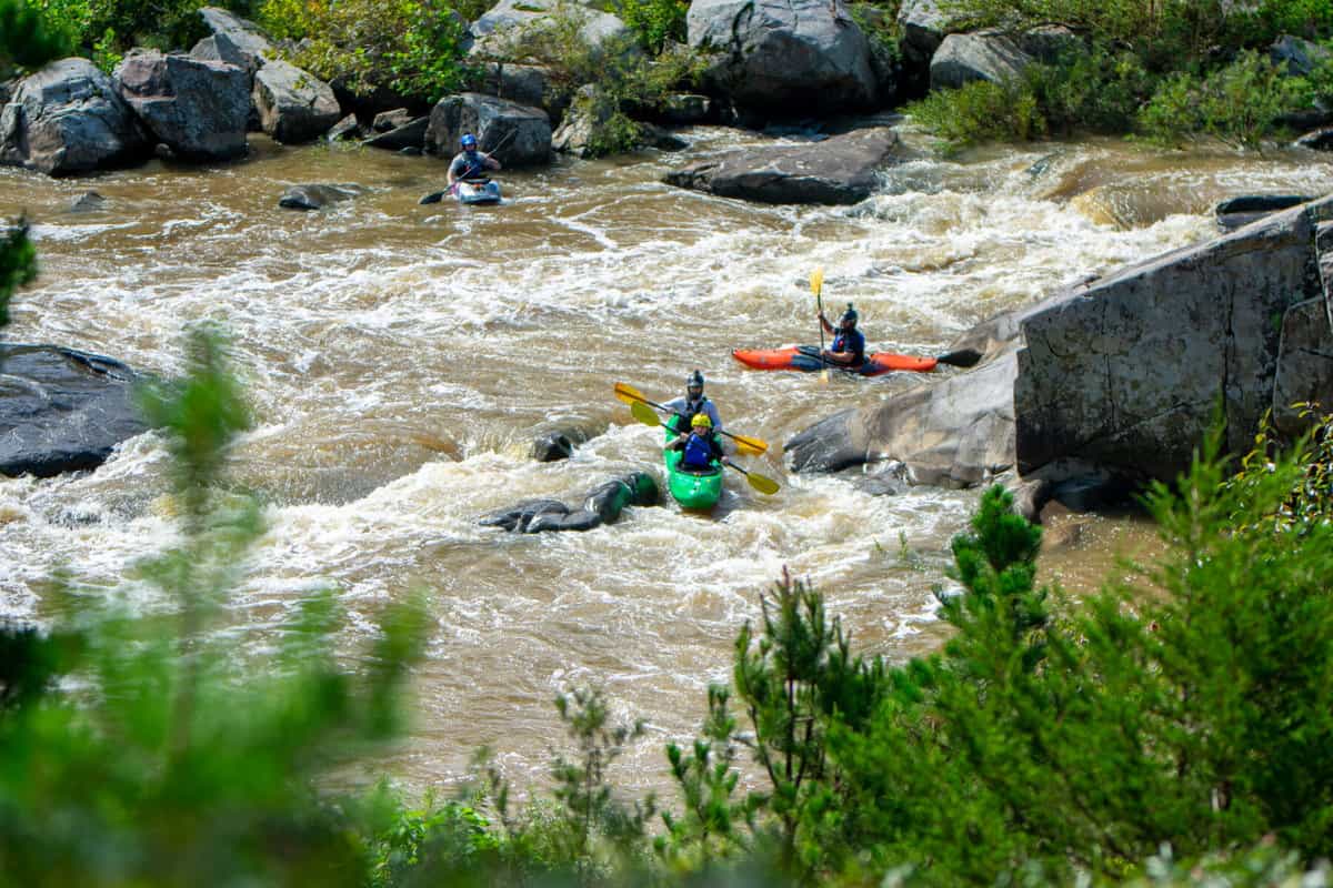 Kayaks navigating Cat's Paw rapids on the St. Francis River.